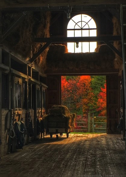 srping creek barn with fall foliage around